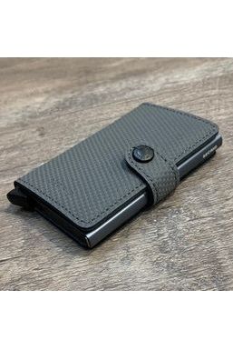 Secrid_Miniwallet_Carbon_Cool_Grey_Image_Shows_Wallet_laying_face_up_on_a_table_Crisp_Home_Wear
