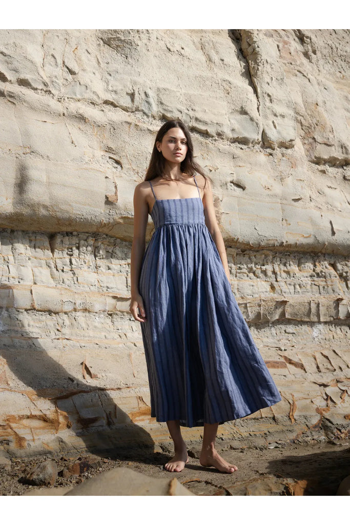 Person wearing the Sophie Go To Sundress in denim stripe.