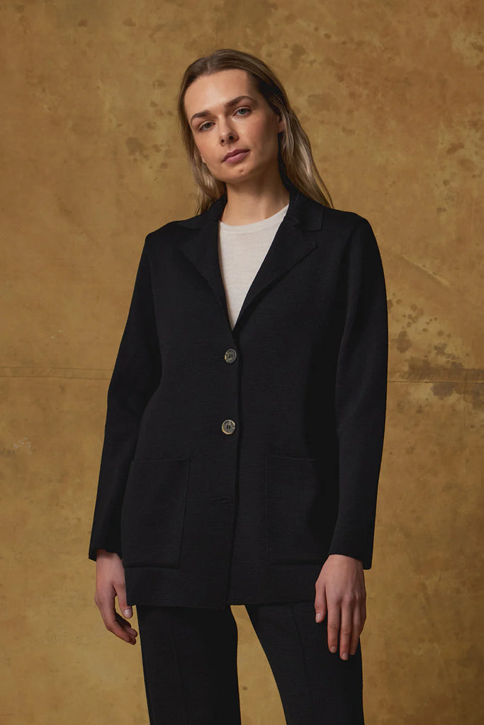 Standard Issue Merino Milano Jacket Black on model with Merino Milano Pants in Black