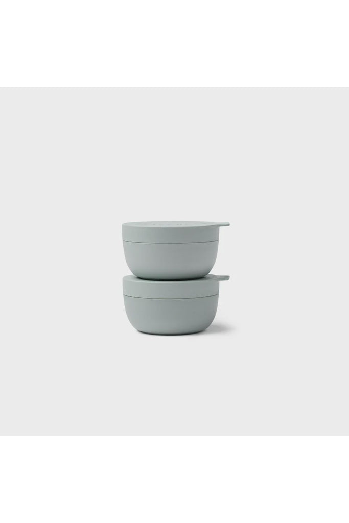 Styleware Mini Bowls in Eucalyptus Green. Two light green/grey bowls with lids stacked on a white background.