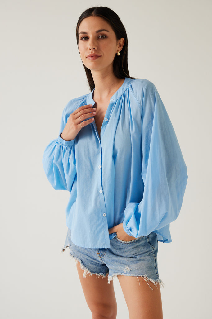 Tuesday Label Pioneer Top, blouse in sky blue on model with jean shorts