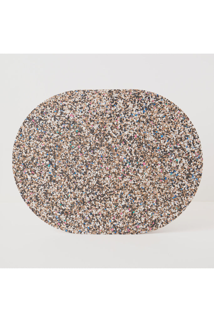 Liga Oval Placemat made from recycled materials—multicoloured speckled placemat mat on a light grey background.