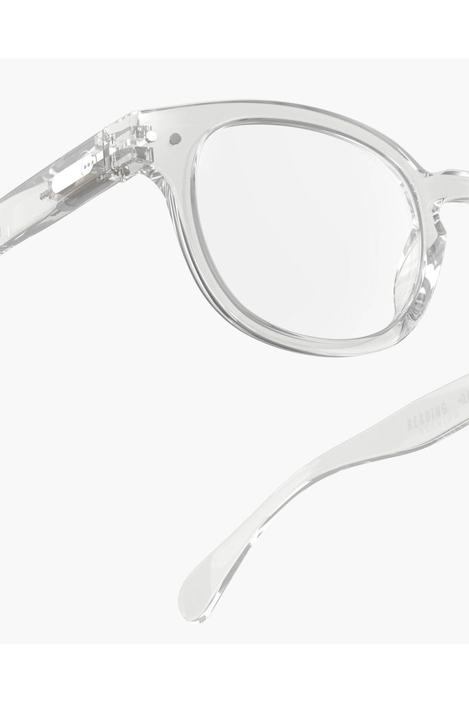 Izipizi Reading Glasses #C Crystal Frame. Clear eyeglasses with silver temple tips on a white background.