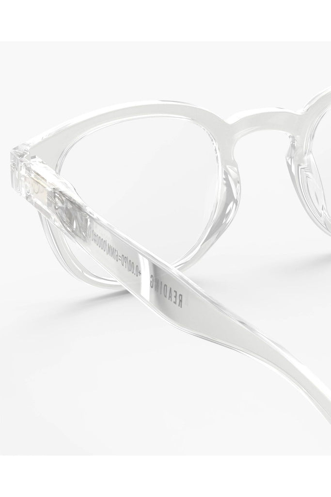 Izipizi Reading Glasses #C Crystal Frame. Clear eyeglasses on a white background eyeglasses with a brand logo on the arm of the glasses.