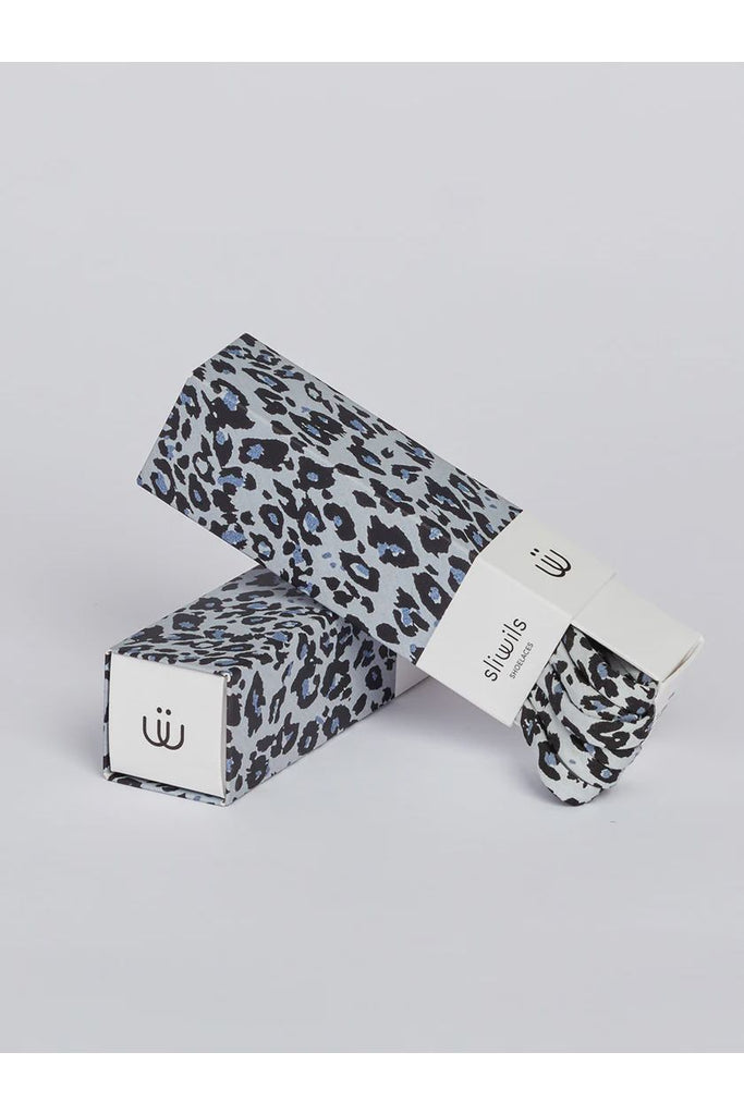 Leopard print shoelaces on a light grey background