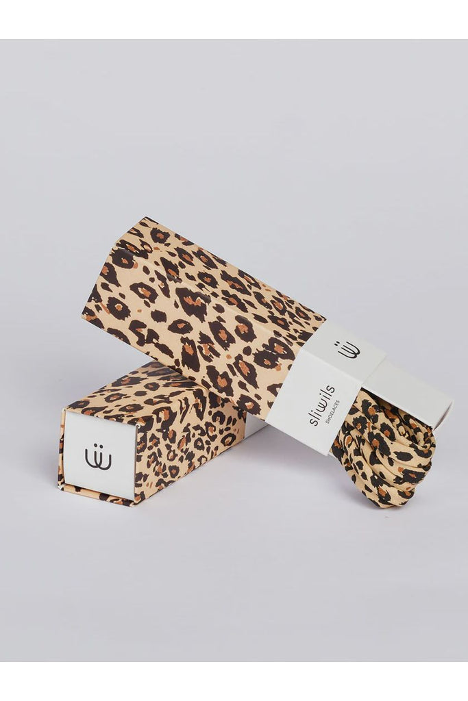 Leopard print shoelaces with packaging on a light grey background
