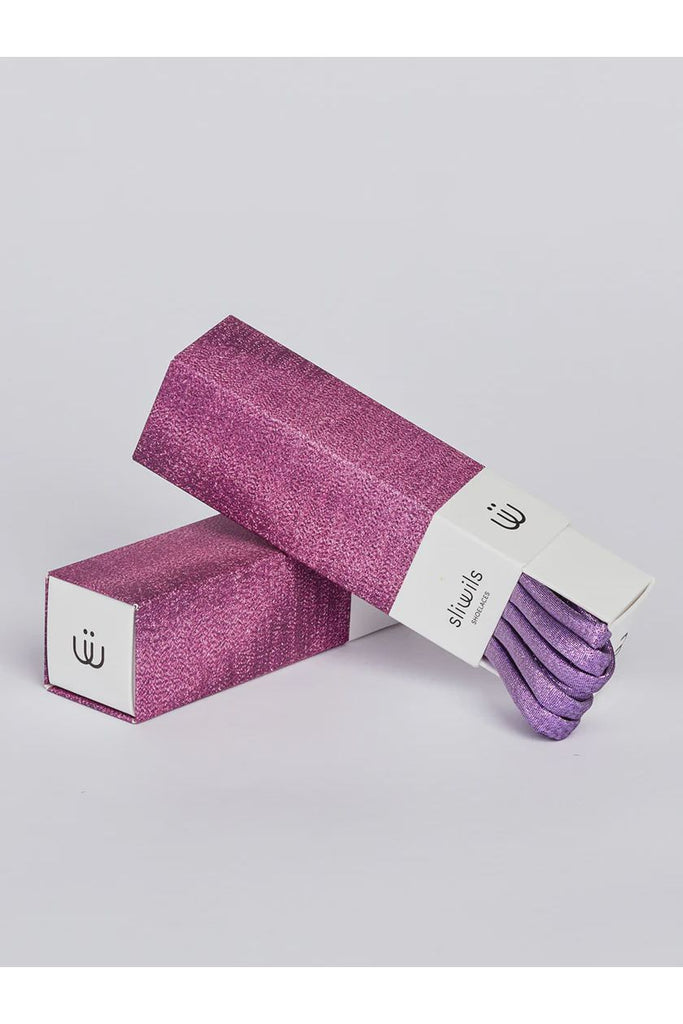 Purple glittery shoelaces with packaging on a light grey background