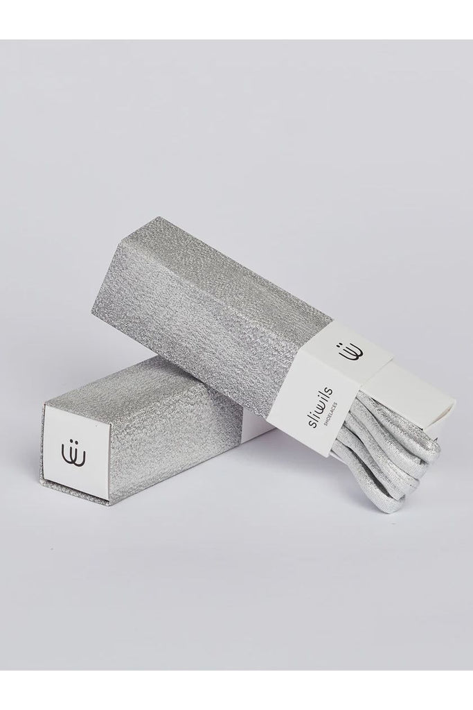 Shiny silver shoelaces with matching packaging on a light grey background