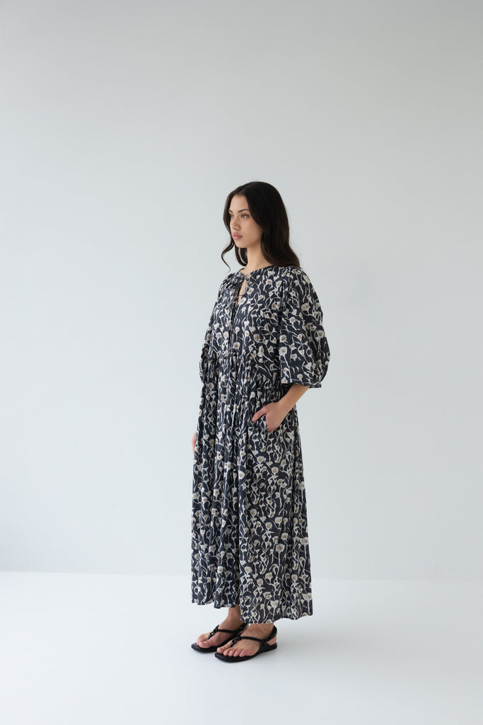 Woman wearing a Sophie Cotton Midi Dress in Coast print