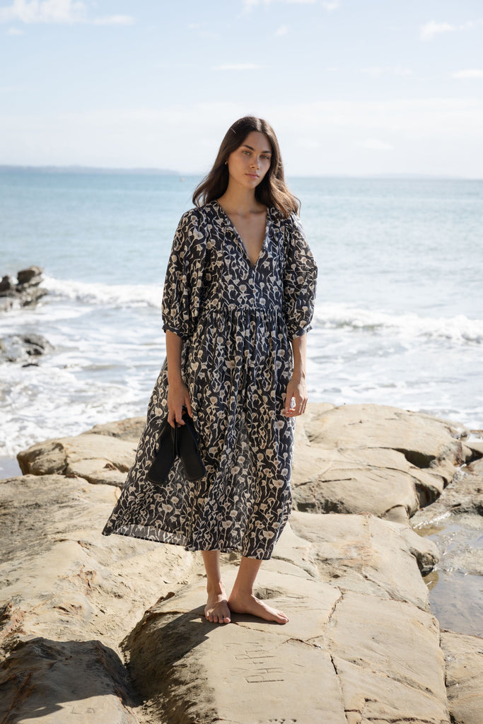 Woman wearing a Sophie Cotton Midi Dress in Coast floral print