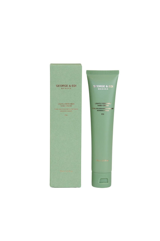 Green tube and packaging of George & Edi hand cream on a white background