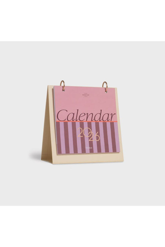 Papier Desk 2026 calendar with pink and white striped design on a white background.