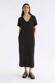 Woman wearing a black dress on a white background. Elk Orta Dress Black,