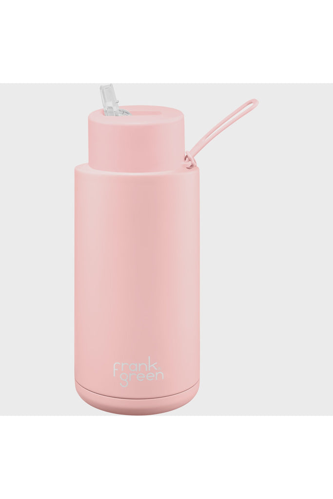 Frank Green Ceramic Reusable 34oz Botlle with Straw in Blushed Pink. Side View showing mouth sipper and bottle strap.
