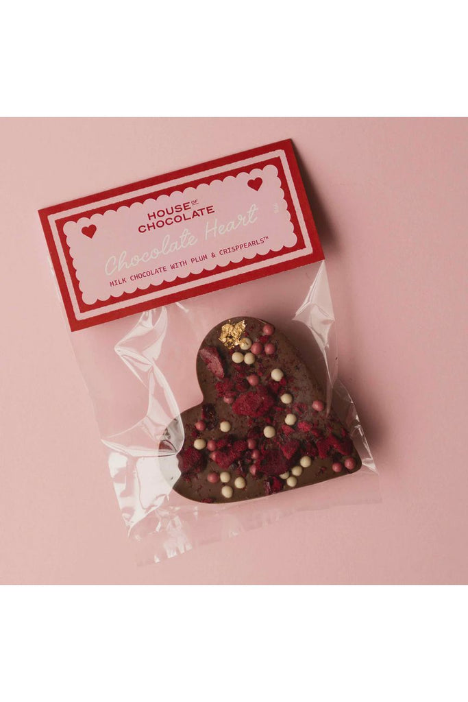 House of Chocolate Large Milk Chocolate Heart with Plum & Crisppearls packaged in a clear plastic pouch with a cardboard header in Pink & red reading Chocolate Heart