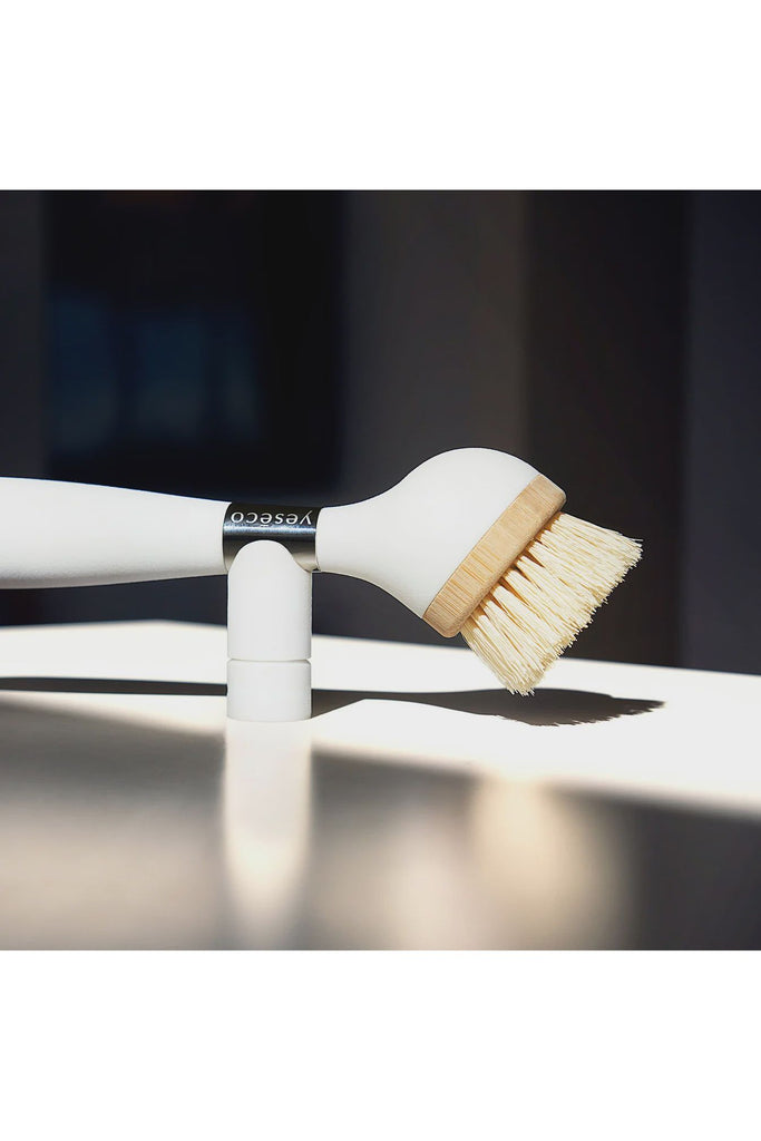 yesco.life The One  Brush Dish Brush White Handle replaceable Dish Head photo of Brush sitting on its magnetic stand.