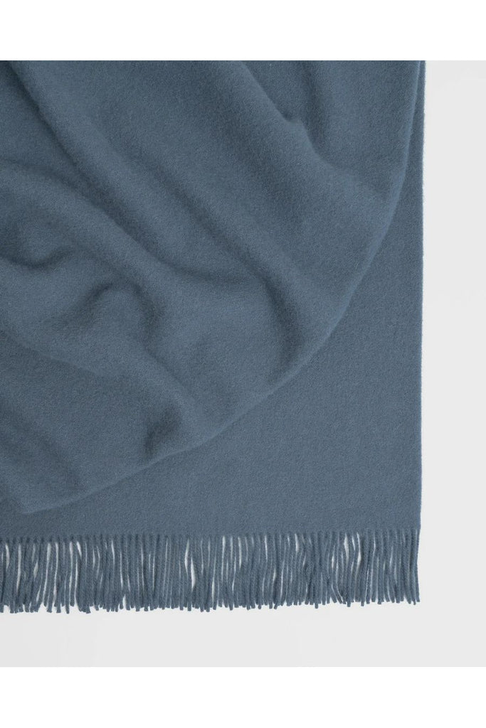 Warwick NZ Weave 100% NZ Wool Nevis Throw Blanket in Nevis Denim is a warm, grey blue.