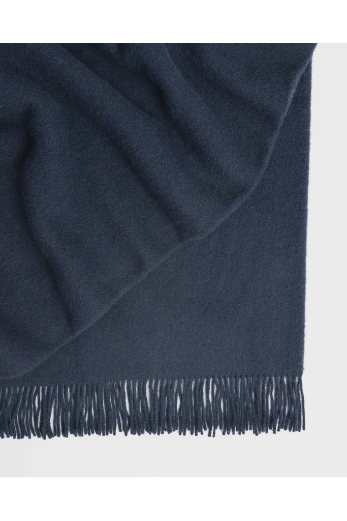 Warwick NZ Weave 100% NZ Wool Nevis Throw Blanket in Nevis Indigo colour is a rich, inky blue.