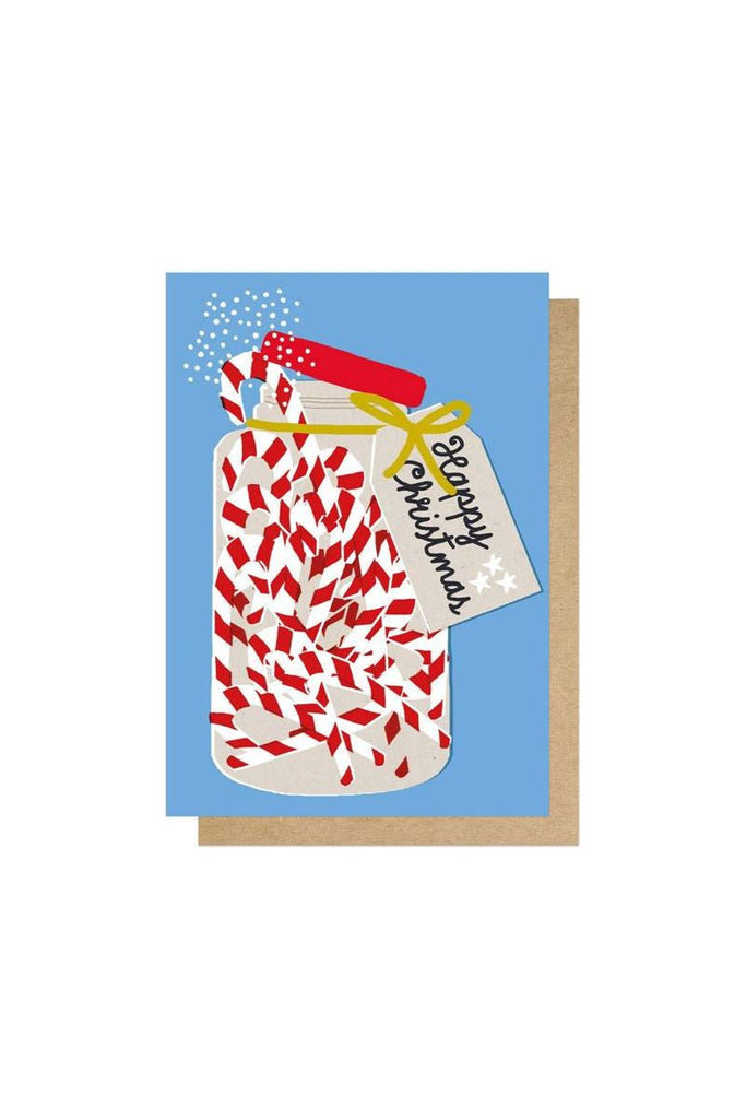 East End Prints Christmas Greeting Card featuring a Jar of Candy Canes with a tag attached around the neck of the jar saying Merry Christmas on a Blue Background 