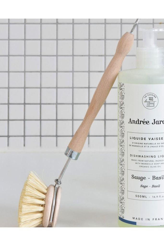 Andree Jardin Beechwood Dishwashing Brush leaning against a bottle of Andree Jardin Dishwashing Liquid 